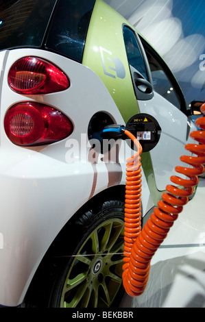 Plug in electric SMART car being recharged at the Frankfurt Motor Show 2009 Stock Photo