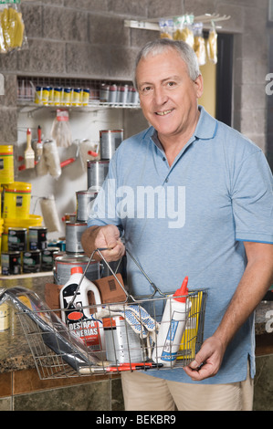 Portrait of a man shopping in a hardware store Stock Photo