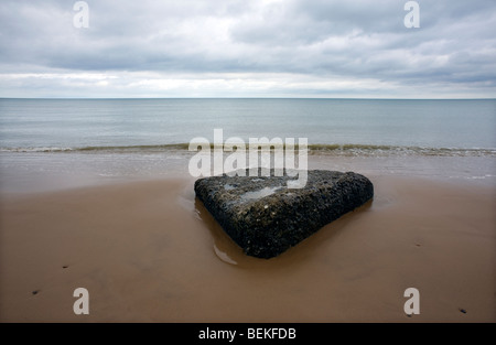 Omaha Beach, Normandy, France. Remains of WW2 D Day German blockhouse ruins on beach. Stock Photo