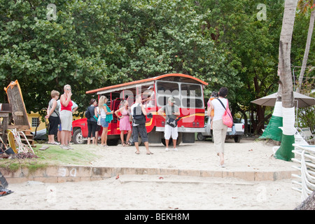 Cruise Ship Passengers bussed to Cane Garden Bay from Road Town Stock Photo