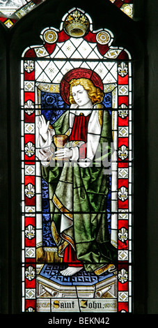 A stained glass window depicting St John, All Saints Church, Shipdham, Norfolk Stock Photo