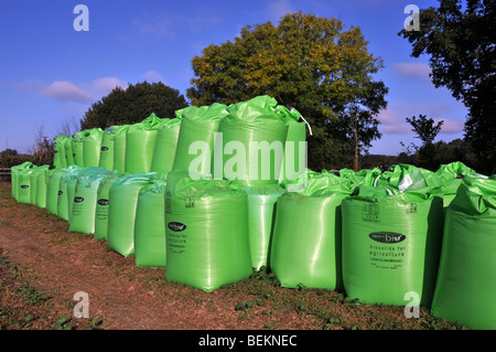 Bags of Biosolid fertiliser made from sewerage by Nutri Bio part of Anglian Water delivered to farm field in green FIBC jumbo bulk bag super sack UK Stock Photo