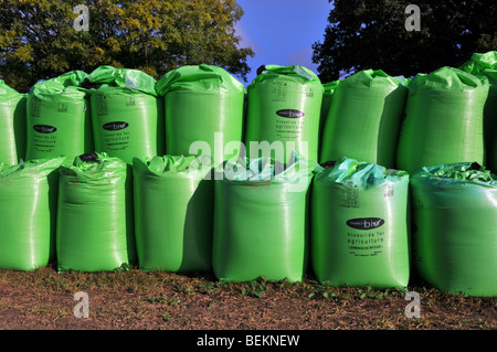 Bags of Biosolids fertilizer from sewage by Nutri Bio part of Anglian Water in farm field delivered in green FIBC jumbo bulk bags super sacks Essex UK Stock Photo