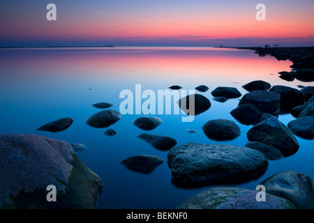 The two piers at the mouth of Daugava river in sunset light Stock Photo