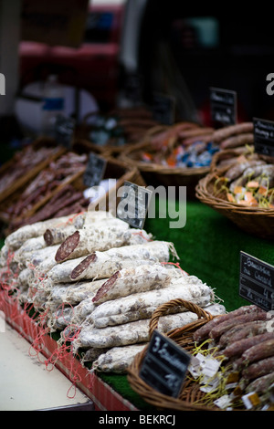 Saucisson on sale at market in Clermont L'Herault Languedoc-Roussillon , France Stock Photo