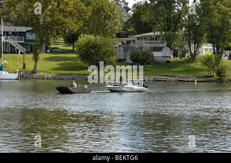 Stalled boat being towed in at Old Hickory Lake near Nashville, Tennessee, USA. Stock Photo