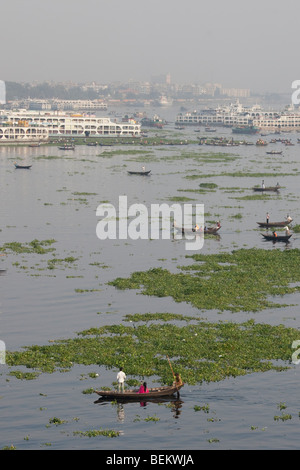 Dingi Nouka or small rowboat taxis on the Buriganga River in Dhaka Bangladesh Stock Photo