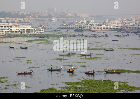 Dingi Nouka or small rowboat taxis on the Buriganga River in Dhaka Bangladesh Stock Photo