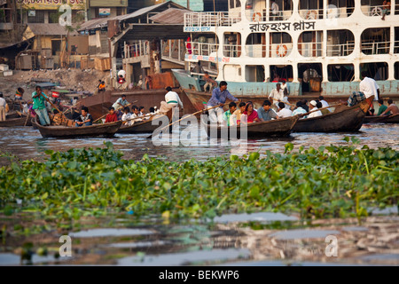 Dingi Nouka or small rowboat taxis on the Buriganga River in Dhaka Bangladesh Stock Photo