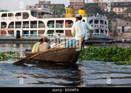 Dingi Nouka or small rowboat taxis on the Buriganga River in Dhaka Bangladesh Stock Photo