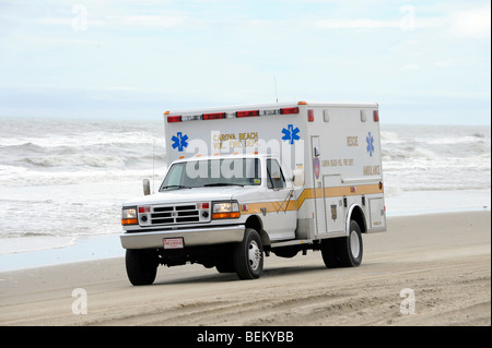 A Carova Beach Ambulance drives on the beach in the northern part section of the Outer Banks in North Carolina. Stock Photo