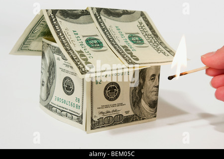 Money house made from dollars isolated on gray background Stock Photo