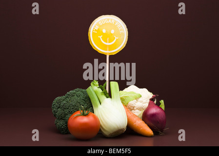 Food concept, pile of fresh vegetables with sugarfree lollipop Stock Photo