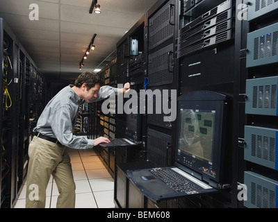 Man working in data center Stock Photo