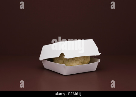 Food concept, fresh cauliflower inside fast food container Stock Photo