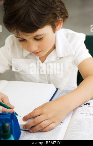 Elementary student working on assignment Stock Photo