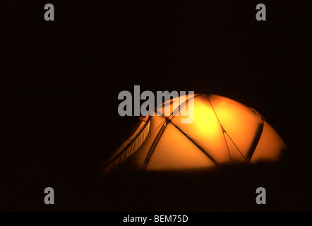 Illuminated tent in the tundra at night, Scandinavia Stock Photo