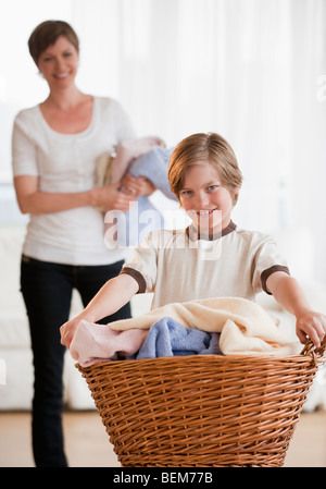 Mother and child doing laundry Stock Photo