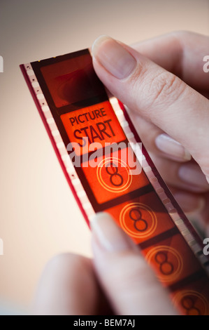 hands holding film strip Stock Photo