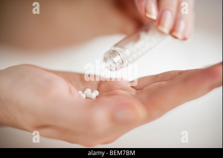 Pills in hand Stock Photo