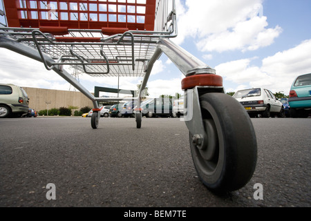 Shopping cart in parking lot, surface level view Stock Photo