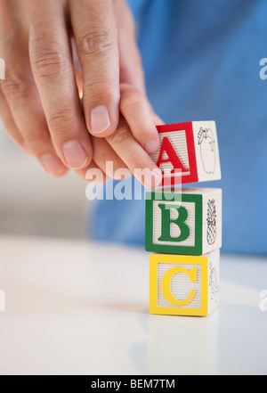 Child playing with ABC blocks Stock Photo