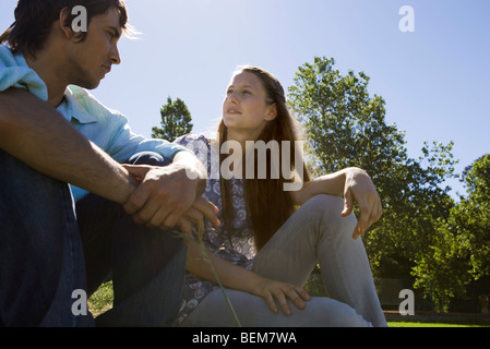 Young couple talking together outdoors Stock Photo