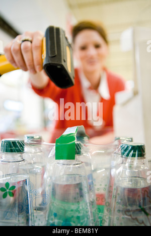 Cashier scanning bar code Stock Photo