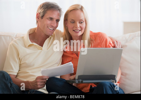 Married couple working on computer Stock Photo