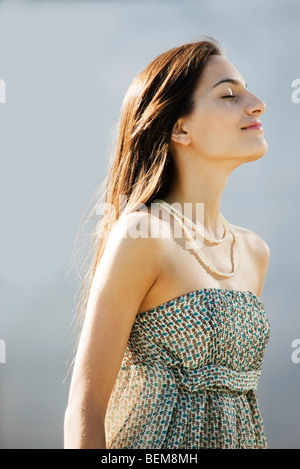 Young woman with head back, eyes closed, portrait Stock Photo