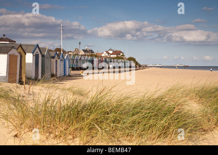 Southwold, Suffolk beach and changing huts with the pier in the background Stock Photo