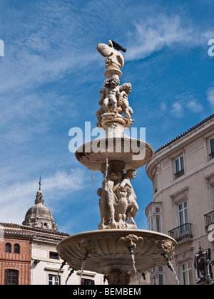 Fountain in the 16th century square of the Plaza de la Constitution, Malaga, Spain Stock Photo
