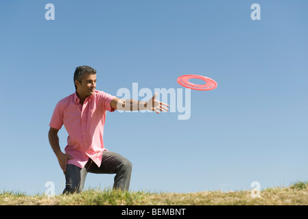 Man throwing flying disc Stock Photo