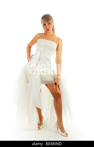 Young blonde woman posing in the bride dress Stock Photo