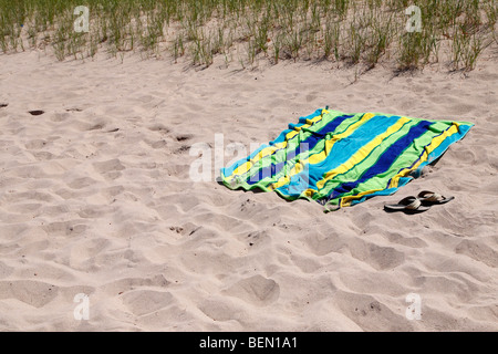 View of sand beach towel and sandals in Michigan USA nobody none hi-res Stock Photo