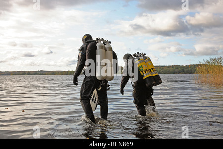 Two scuba divers preparing a dive in Esrum Lake, Denmark. Stock Photo