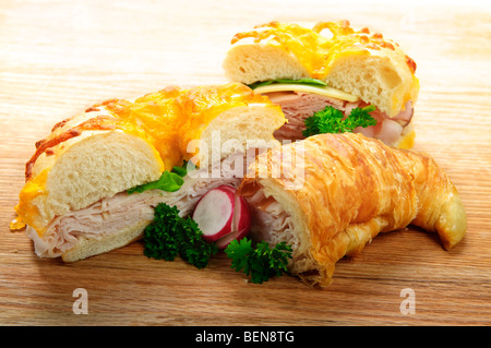 Assorted bagel and croissant sandwiches with meat and vegetables Stock Photo