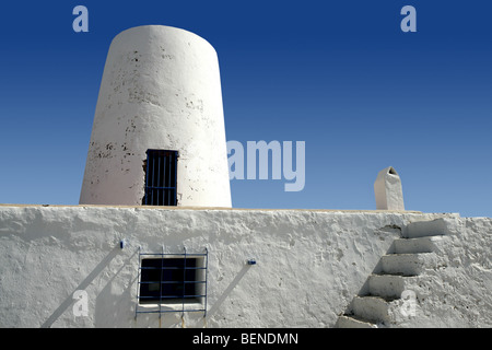 Balearic islands architecture white mill in Formentera over blue sky Stock Photo