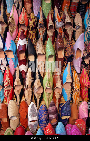 Colourful leather Moroccan mules / babouches on display at souvenir shop in Marrakesh / Marrakech, Morocco, North Africa Stock Photo