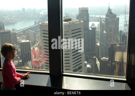 Child Looking Out From The Telecom Tower, Sydney, New South Wales, Australia. Stock Photo