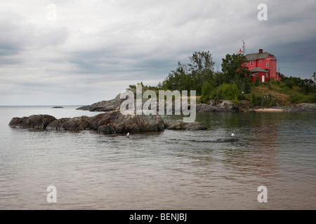 Red Marquette Maritime Museum and Lighthouse on Lake Superior in Michigan USA nobody hi-res Stock Photo