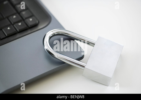 Padlock on laptop computer Stock Photo