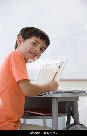 Elementary school children sitting at individual desks in Swedish ...