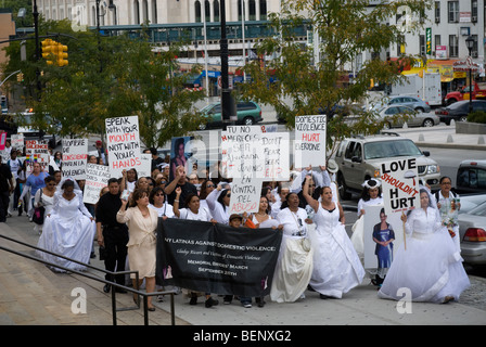 Women dressed as brides march in the 9th Annual Gladys Ricart and Victims of Domestic Violence Memorial Walk Stock Photo