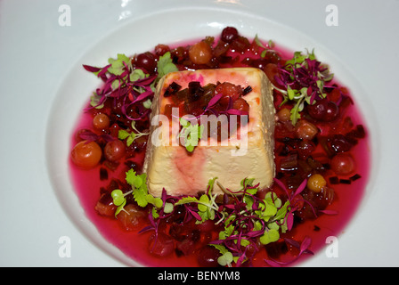 Smoked organic goat cheese with sweet tart crimson Hawaiian cranberries sauce glaze appetizer spread Stock Photo