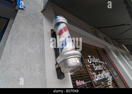 beauty and barber shop with pole small town Stock Photo