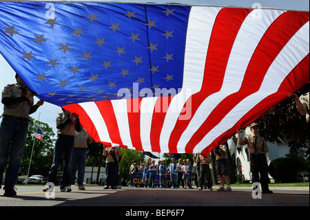 Scouts carry large american flag in Memorial Day parade Stock Photo
