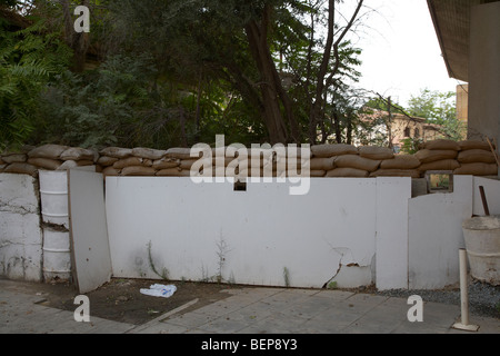 sandbagged wall and firing points across no mans land and restricted area of the UN buffer zone in the green line Stock Photo