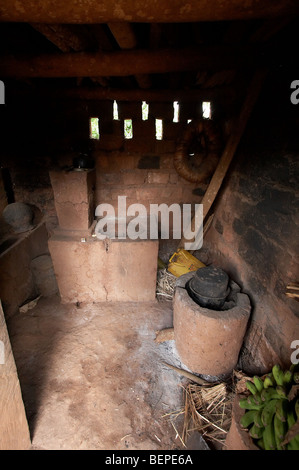 UGANDA A fuel-efficient wood burning cooking stove being used, Kayunga ...