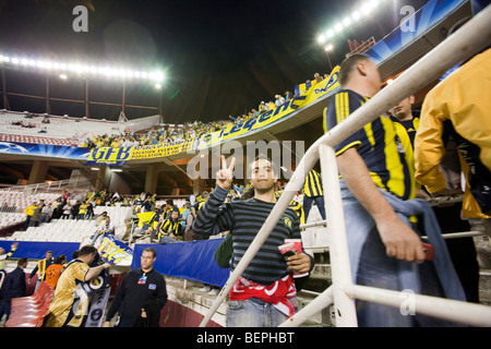Fenerbahce fans. UEFA Champions League first knockout round game (second leg) between Sevilla FC (Seville, Spain) and Stock Photo